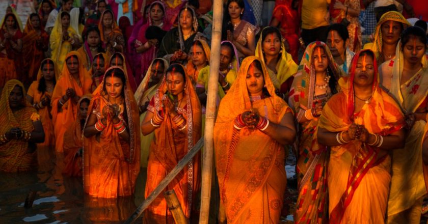 Hindu devotees flock to rivers for prayers to the sun god