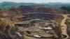 FILE - Excavators and drillers at work in an open pit at Tenke Fungurume, a copper and cobalt mine 110 km (68 miles) northwest of Lubumbashi in Congo's copper-producing south, Jan. 29, 2013. 