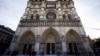 People stand outside Notre Dame cathedral in Paris on Nov. 29 2024. 