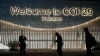 People walk outside the venue for the COP29 U.N. Climate Summit, in Baku, Azerbaijan, Nov. 11, 2024. 