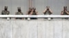 FILE - North Korean army soldiers watch during a South Korean official's visit to Panmunjom in the Demilitarized Zone, Sept. 16, 2020.