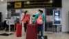 FILE - Chinese tourists arrive at Chiang Mai international airport in Chiang Mai province, northern Thailand, Jan. 23, 2023. Numbers of Chinese tourists traveling to Thailand recently have slumped. Some blame a movie highlighting how visitors are scammed in Southeast Asia.