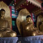 North Koreans pray to Buddha statues for good luck