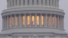 FILE - A United States flag flies in front of the U.S. Capitol dome in Washington, Nov. 6, 2018. U.S. intelligence officials warned on Oct. 22, 2024, that Russia and Iran are stepping up efforts to sow distrust and spark violence before and after the Nov. 5 presidential election.