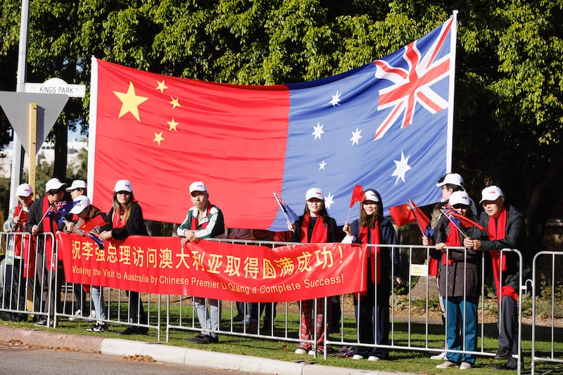 Supporters await the arrival of Chinese Premier Li Qiang and Australian Prime Minister Anthony Albanese to Kings Park in Perth, Australia, June 18, 2024.