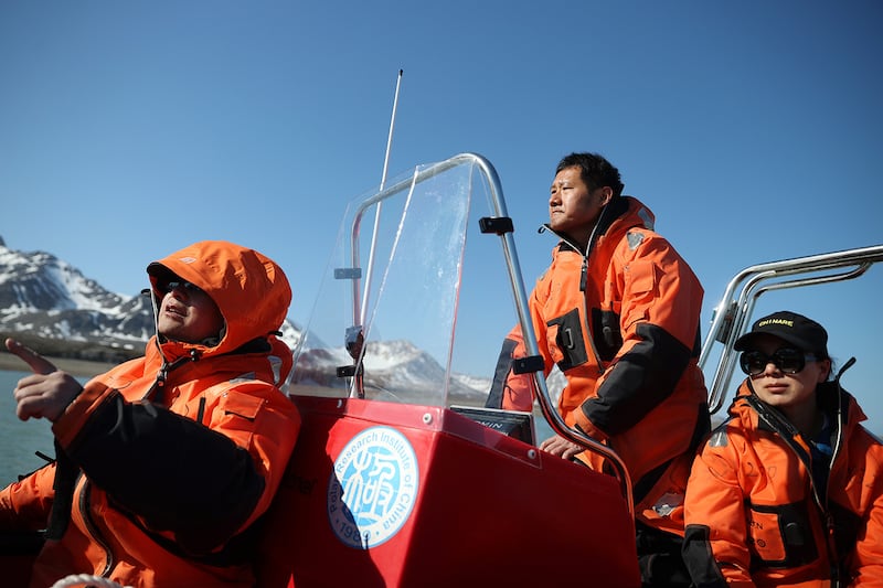 Members of China’s Arctic expedition team, based at the Yellow River Research Station, take a boat out for sampling on the Austre Lovenbreen glacier in Svalbard, Norway, June 22, 2024.