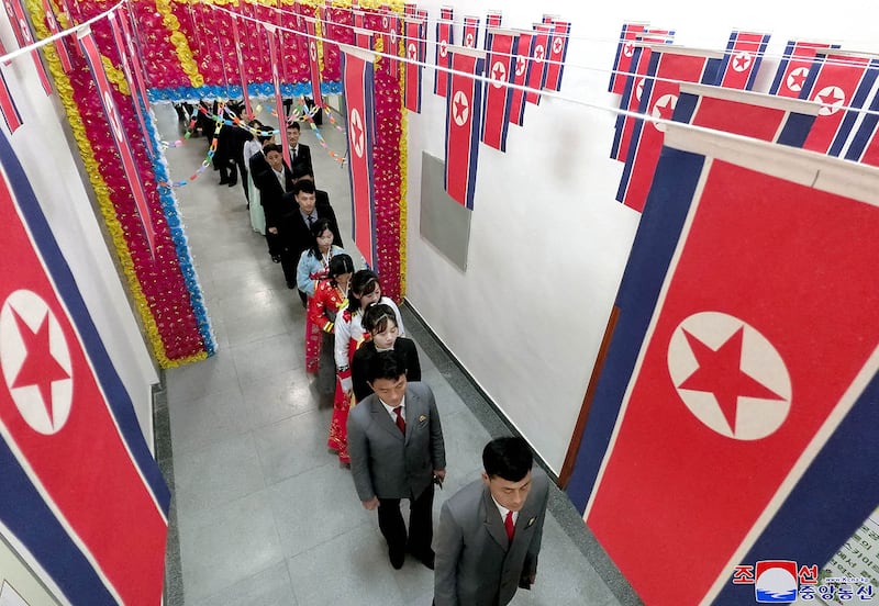 People line up to vote during a local election for the provincial and county people's assembly in North Korea, Nov. 26, 2023.