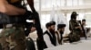 FILE - Afghanistan Taliban officials attend a news conference in Kabul, Afghanistan October 5, 2021. 