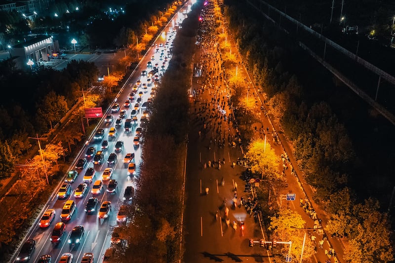 Thousands of college students ride bicycles on the Zhengkai Road in Zhengzhou, in China\'s Henan province, Nov.  9, 2024.