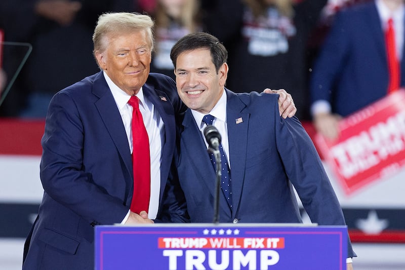 Former President Donald Trump greets Sen. Marco Rubio during a campaign rally in Raleigh, North Carolina, on Nov. 4, 2024.