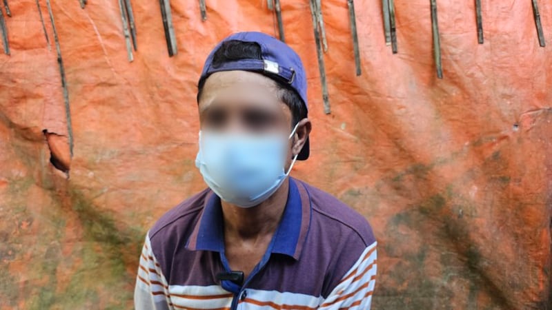 A 42-year-old Rohingya who volunteered to fight for the Myanmar government speaks to BenarNews, which blurred his face over safety concerns, after returning to a Cox’s Bazar, Bangladesh, refugee camp, Oct. 10, 2024.