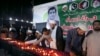 FILE - Members of the Shiite Ulema Council attend a candlelight vigil in Karachi, Pakistan, Oct. 29, 2022, for Pakistani journalist Arshad Sharif, killed by police near Nairobi, Kenya. 