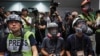 FILE - In a sign of protest against the police using force against the media, press photographers wear protective gear during a police media conference in Hong Kong, Sept. 9, 2019. Once a model for press freedom in the Asia region, Hong Kong's ranking has plummeted.