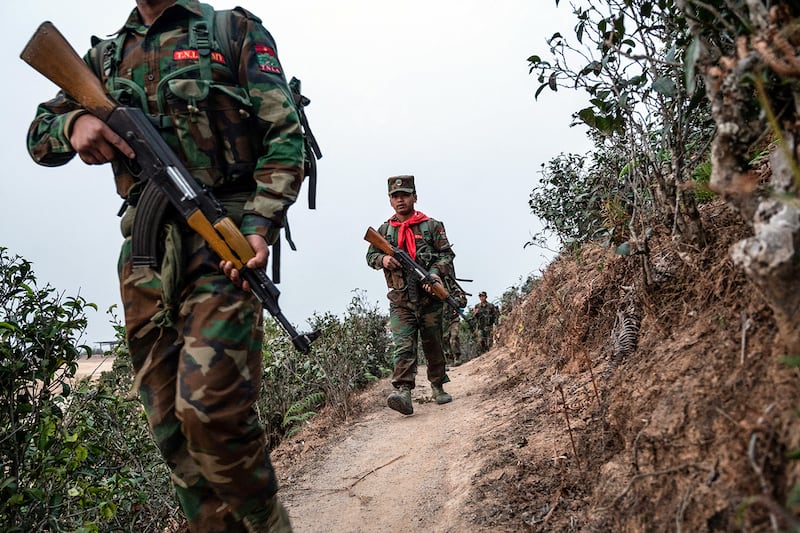 Ethnic rebel group Ta\'ang National Liberation Army patrol near Namhsan Township in Myanmar\'s northern Shan State. (AFP)