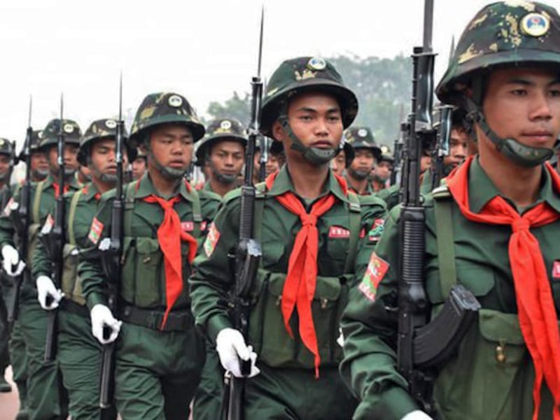 Troops of the United Wa State Army march in a military parade on April 14, 2019.