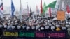 Protesters stage a rally demanding the arrest of impeached South Korean President Yoon Suk Yeol near the presidential residence in Seoul, South Korea, Jan. 5, 2025. The banner reads 'Arrest Yoon Suk Yeol.' 